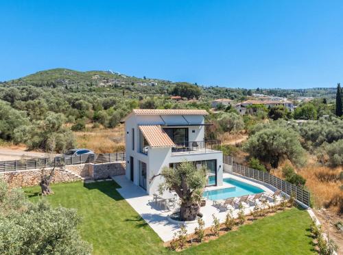 an aerial view of a villa with a swimming pool at Avelia Villa Tsoukalades in Tsoukalades