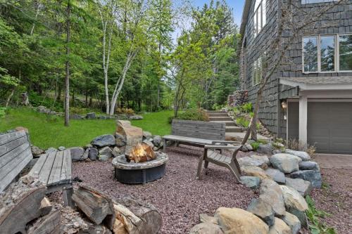 a backyard with a fire pit and a bench at Elk Run in Whitefish