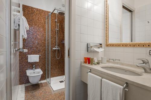 a bathroom with a sink and a shower at Al Ponte Antico in Venice