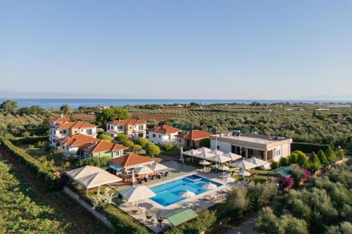 an aerial view of a villa with a swimming pool at Stomio Villague in Filiatra