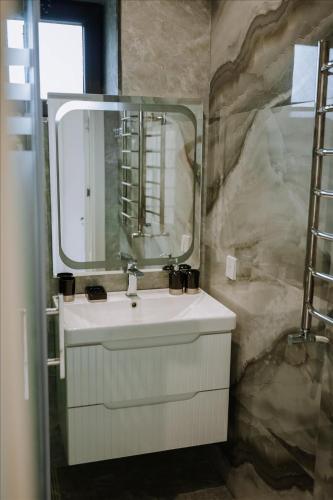 a bathroom with a sink and a mirror at Quba Garden Resort in Quba