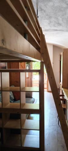 a staircase in a room with bunk beds at Al Volto in Roncegno