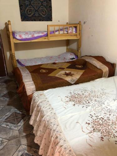 two twin beds in a room withthritisthritisthritisthritisthritisthritisthritisthritisthritis at La Soñada in Coronel Martínez