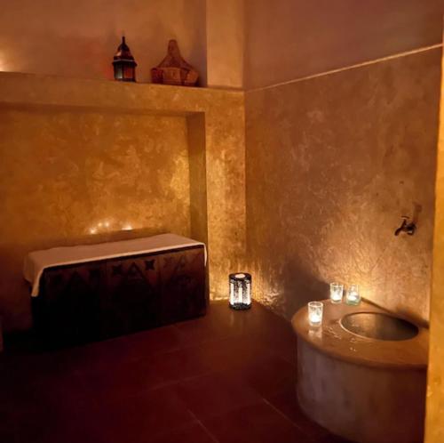 a bathroom with a tub and a sink at Villa Riad Ambre in Douar bel Rhanodour