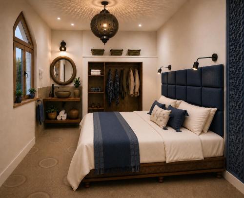 a bedroom with a large bed and a mirror at Ocean Wings House in Rbat
