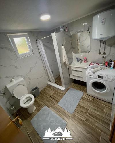 a small bathroom with a toilet and a sink at Odmaraliste Paradise14 - Private Villa with Heated Pool & Jacuzzi in Rainci Gornji