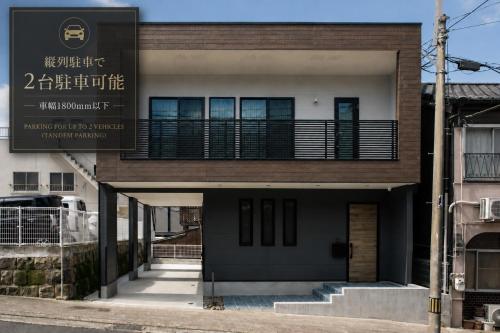 a building with a sign on the front of it at VILLA Sasebo Stad #SS1 in Sasebo