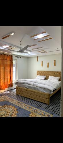 a bedroom with a large bed in a room at Stone Leaf Retreat - Skardu in Skardu