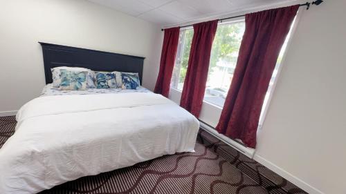 a bedroom with a large bed and a window at Entire condo in White Rock, Canada in White Rock