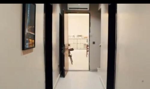 a hallway with a door leading to a room at Degrams Hotel and suites in Epe