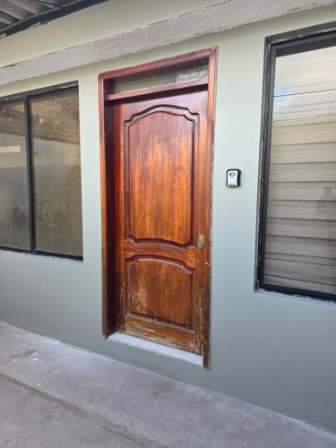 a wooden door on the side of a building at Verona house in Riobamba