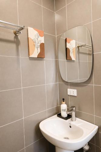 a bathroom with a sink and a mirror at Casa Blanca Tanay in Tanay