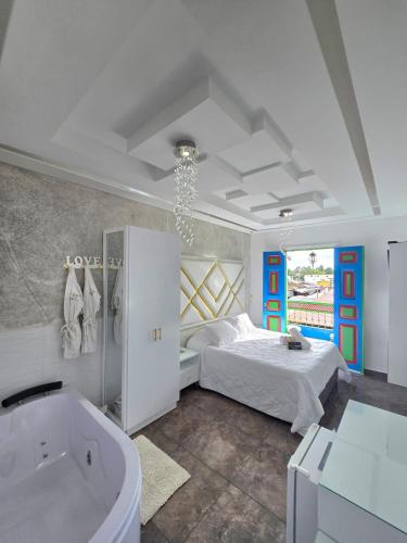 a bedroom with a bed and a bath tub at Casa Boutique Hotel in Salento