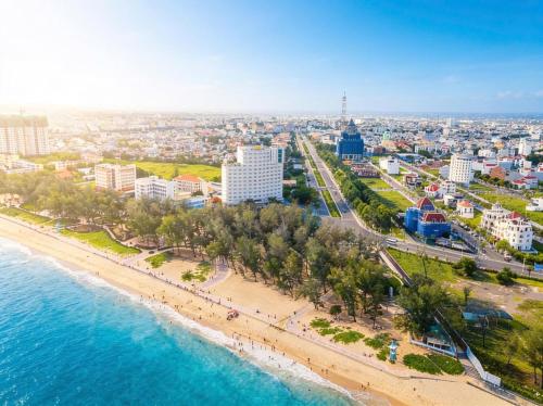 an aerial view of a beach and a city at TTC Hotel Phan Thiet in Phan Thiet