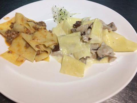 a white plate of food with meat and cheese at Country House Salomè in Musile di Piave