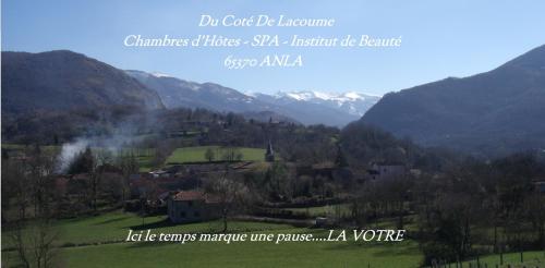 a town in a valley with mountains in the background at Du Coté de Lacoume in Anla
