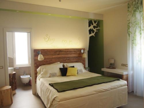 Postel nebo postele na pokoji v ubytování Piccolo Hotel