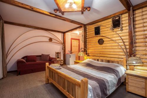 Postel nebo postele na pokoji v ubytování Vatra Hotel