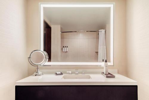 a bathroom with a sink and a mirror at Grand Hyatt Denver in Denver