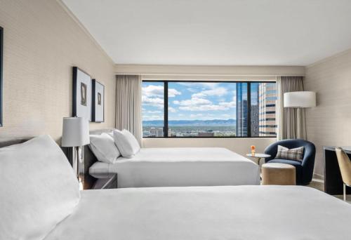 a hotel room with two beds and a window at Grand Hyatt Denver in Denver