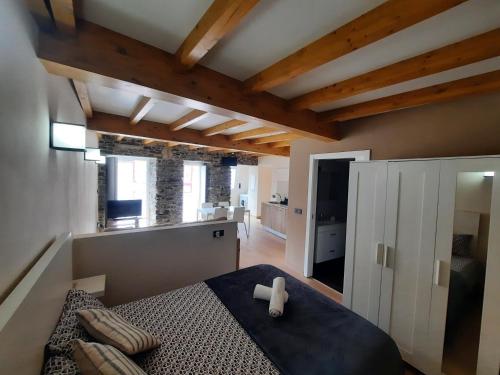 a bedroom with a bed with a cross on it at O Recuncho de Mugardos in Mugardos