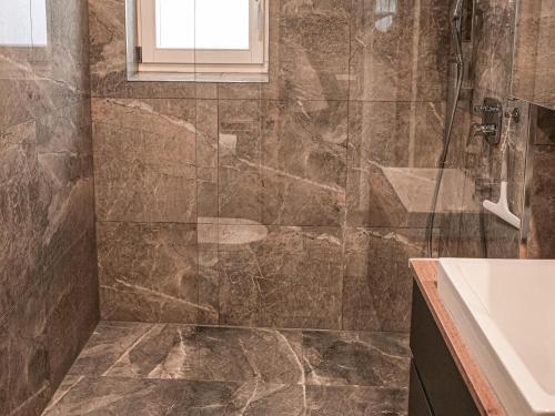 a bathroom with a shower and a sink at Modern apartment in Seefeld in Reith bei Seefeld