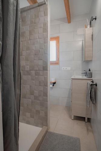 a bathroom with a shower and a sink at Can Vicent Corda in Sant Francesc Xavier