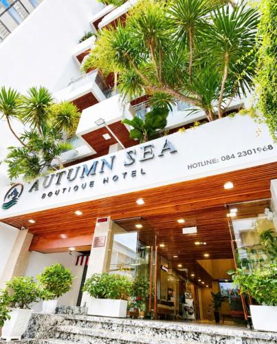 a building with a sign that reads autumn sky couture motel at Autumn Sea Boutique Hotel in Nha Trang