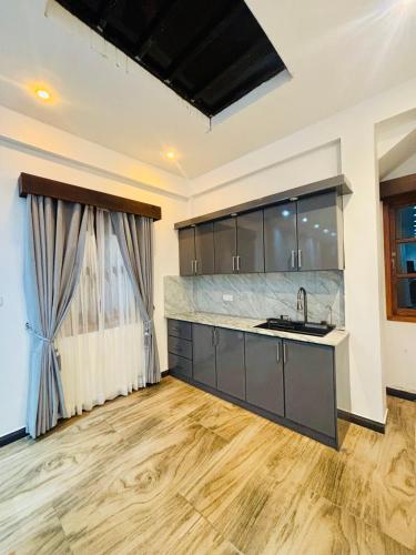 a kitchen with a sink and a counter at SB Guest in Trincomalee
