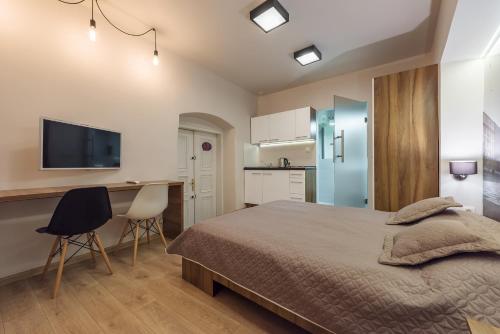 Kuchyňa alebo kuchynka v ubytovaní Krakow For You Budget Apartments