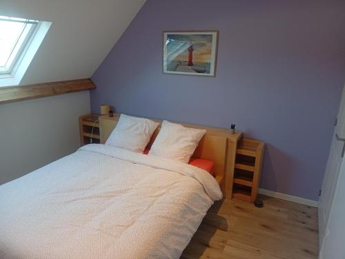 a bedroom with a bed with white sheets and a window at Cote d'opale Terre & Mer in Outreau