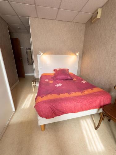 Postelja oz. postelje v sobi nastanitve Studio confortable à Néris-les-Bains - 18 m² + Balcon