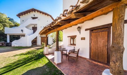 an external view of a house with a table and chairs at Spacious Apartment in Yeste with Shared Pool in Yeste