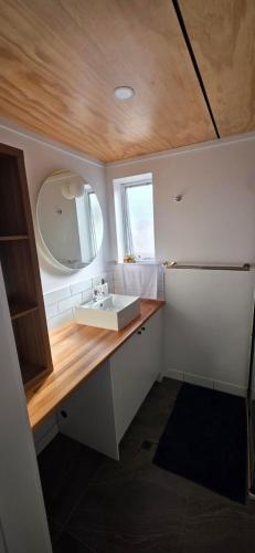 a bathroom with a sink and a mirror at Studio in Quindalup bay in Quindalup