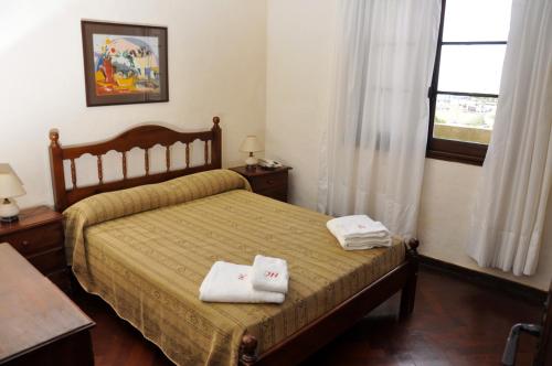 Ліжко або ліжка в номері Hotel Covadonga