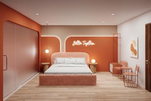 a bedroom with a bed and a table and chairs at Sanora Hotel in Hanoi