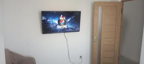 a picture hanging on a wall in a room at Twins Residence 2 APART HOTEL AP 2 2 rooms in Chiajna
