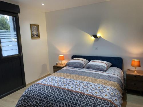 a bedroom with a bed with two pillows on it at Gite de l'etoile in Rocroi