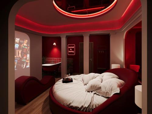 a bedroom with a bed with a red ceiling at Sanora Hotel in Hanoi