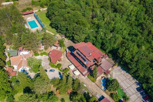 an aerial view of a house with a pool at Хотел Галина Палас in Srem
