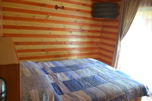 A bed or beds in a room at Algarrobo Lodge