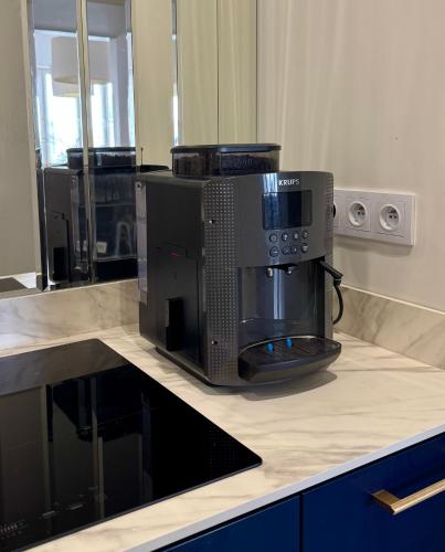 a coffee maker sitting on top of a counter at Art Deco Retreat - Łódź Centrum in Łódź