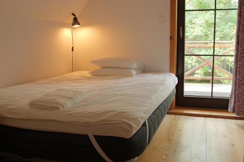 a large bed in a room with a window at Bondyrz 134 in Bondyrz