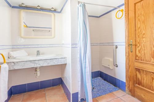 a bathroom with a sink and a shower at Monte Naranja in Jávea