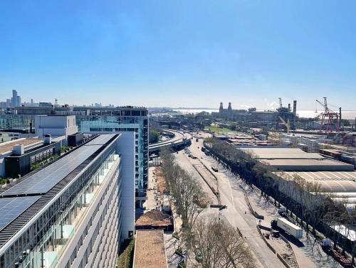 an aerial view of a city with buildings and a street at Almarena Puerto Retiro, Affiliated by Meliá in Buenos Aires