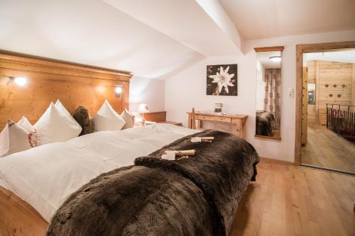 Postel nebo postele na pokoji v ubytování Brixnerhof im Zillertal