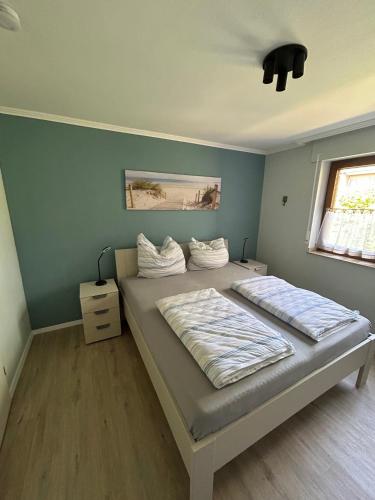 a bedroom with two beds and a window at Apartment Grenzland in Herzogenrath