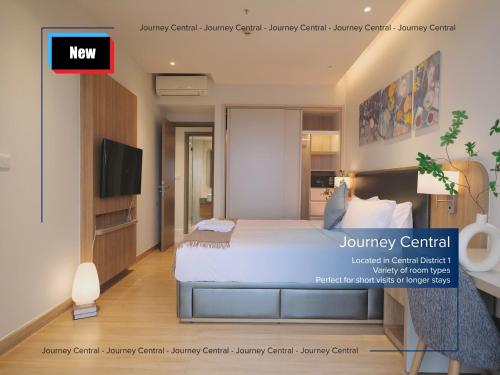 a bedroom with a large bed and a tv at Journey Central - ZENITY & D1 MENSION in Ho Chi Minh City
