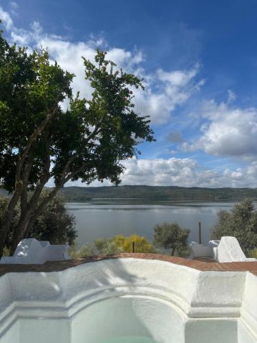 a view of a lake from a house at Herdade Monte da Tapada in Alqueva