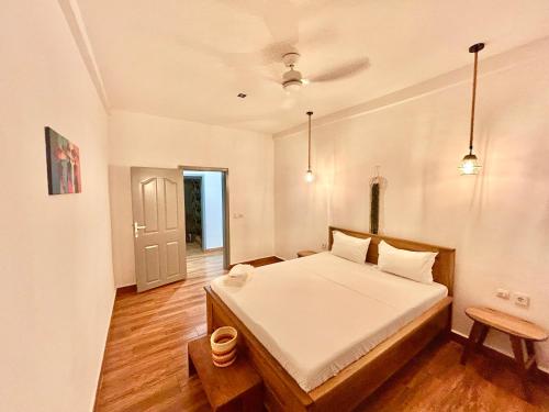 a bedroom with a large bed in a room at Villa Soafeno in Antsiranana
